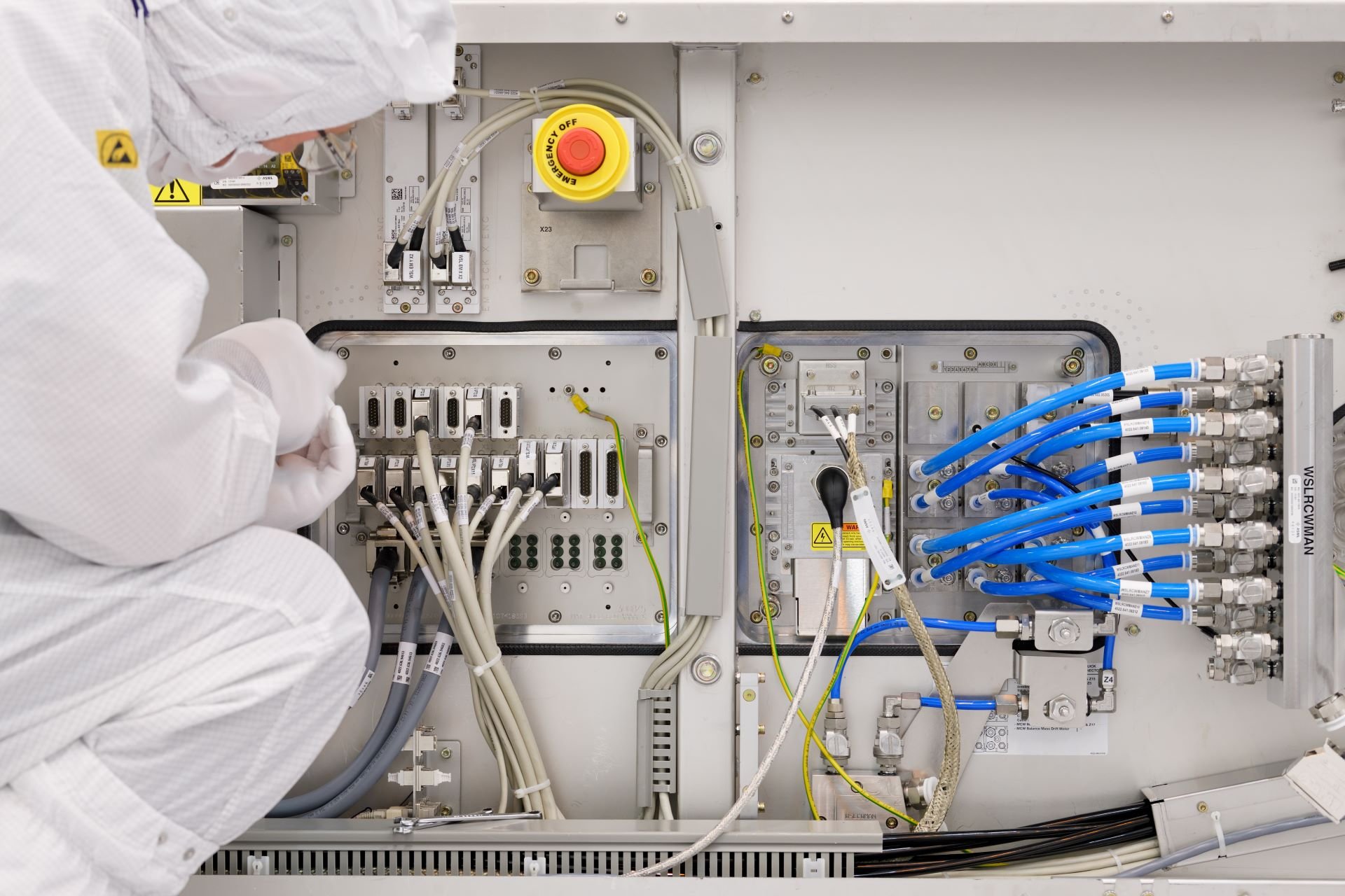 ASML technician working on a machine component
